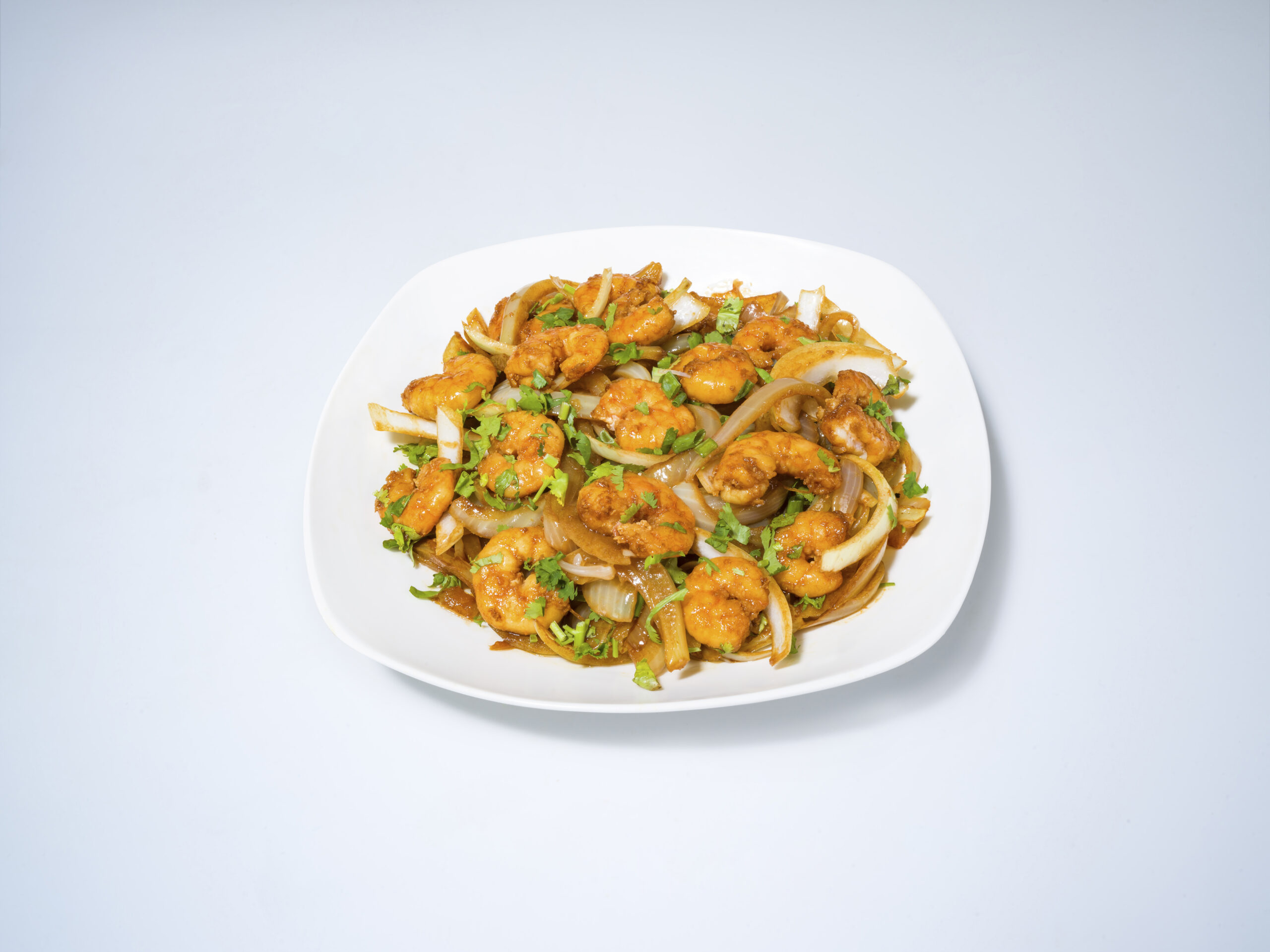 Crevettes aux oignons